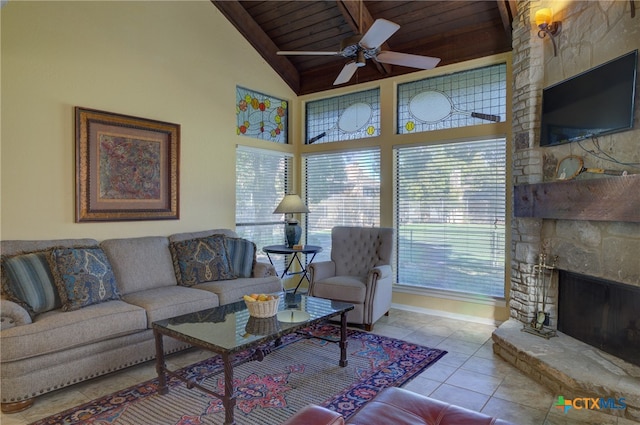 tiled living room featuring ceiling fan, wooden ceiling, lofted ceiling, and a stone fireplace