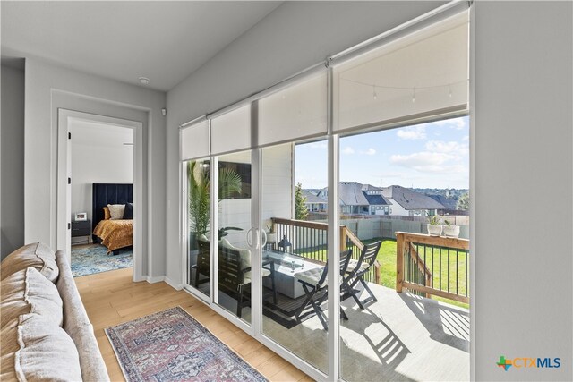 doorway to outside with light hardwood / wood-style flooring