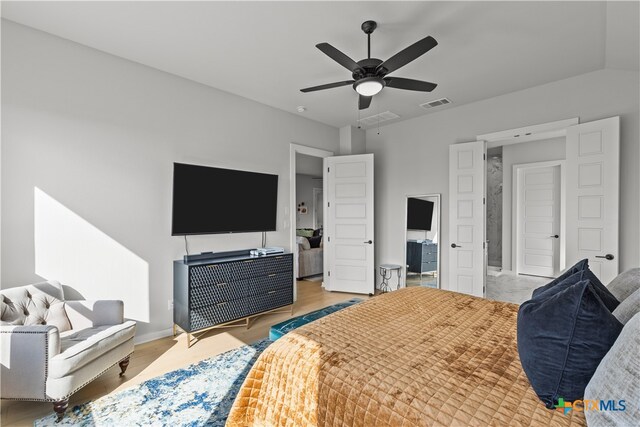 bedroom with light wood-type flooring and ceiling fan