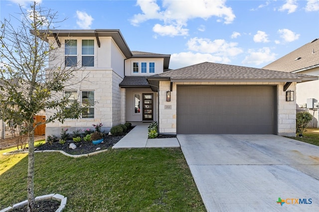 view of front facade featuring a garage and a front lawn