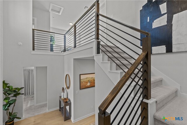 staircase featuring hardwood / wood-style flooring