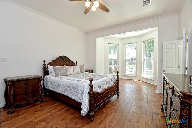 1108 Celtic Cv, Round Rock, TX 78681 - bedroom with ornamental molding, hardwood / wood-style flooring, and ceiling fan