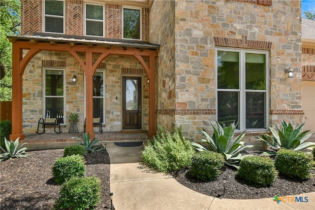 1108 Celtic Cv, Round Rock, TX 78681 - entrance to property with stone siding and covered porch