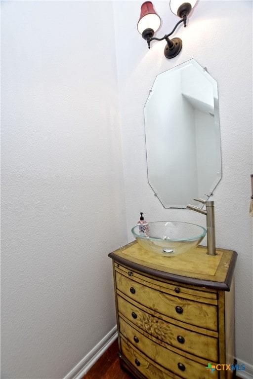 1108 Celtic Cv, Round Rock, TX 78681 - bathroom with vanity and wood finished floors