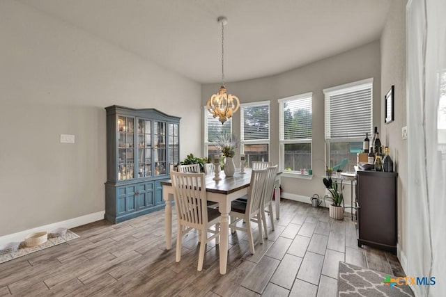 920 Carriage Loop, New Braunfels, TX 78132 - dining area with a chandelier, wood tiled floors, and baseboards