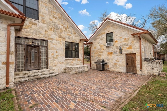 view of patio featuring a grill