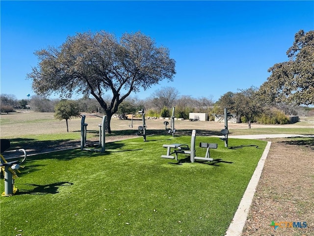 view of property's community featuring a yard