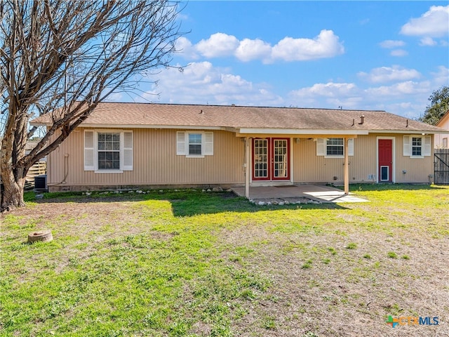 back of house with a yard, central AC, and a patio