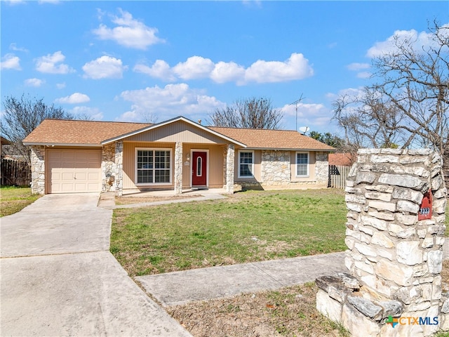 ranch-style house with driveway, stone siding, a garage, and a front lawn