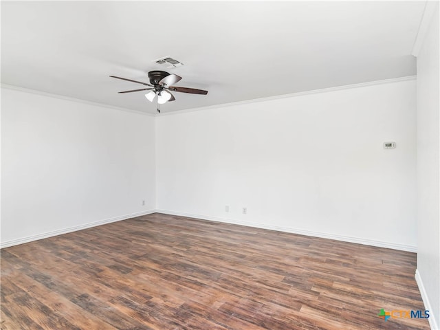 unfurnished room featuring ornamental molding, visible vents, ceiling fan, and dark wood-type flooring