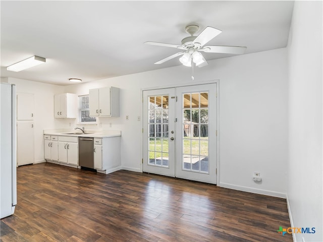 kitchen with dishwasher, freestanding refrigerator, light countertops, french doors, and a sink