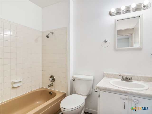 bathroom featuring toilet, vanity, and shower / tub combination