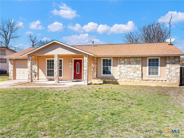 ranch-style house featuring a garage, stone siding, a front lawn, and concrete driveway