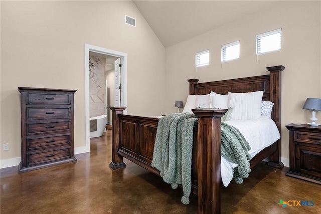 bedroom featuring connected bathroom and high vaulted ceiling