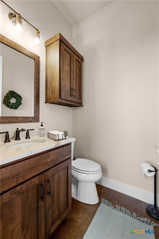 bathroom with vanity and toilet