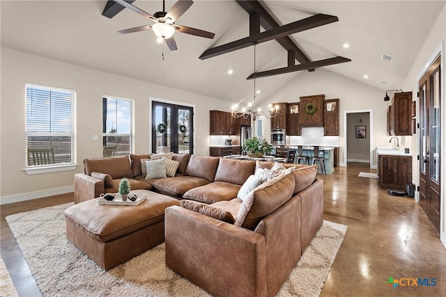 living room with beamed ceiling, concrete floors, high vaulted ceiling, and ceiling fan with notable chandelier