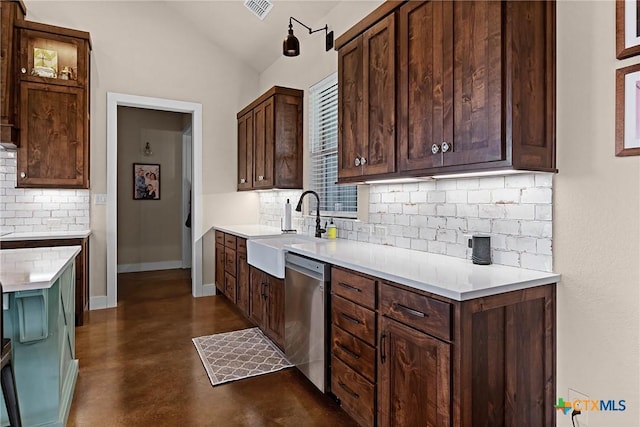 kitchen featuring dishwasher, dark brown cabinetry, decorative backsplash, and sink