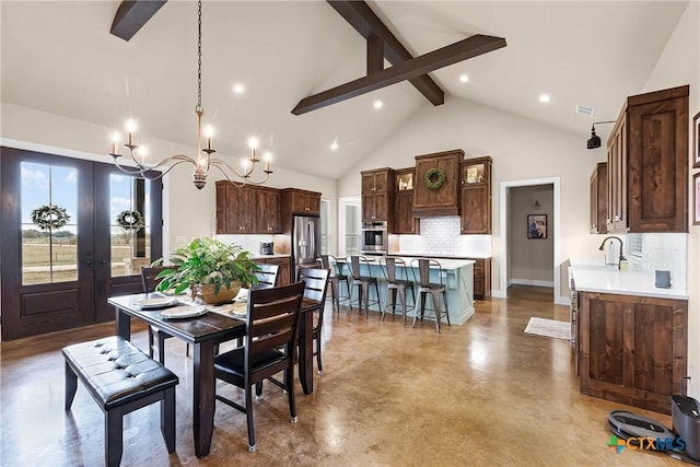 dining area with high vaulted ceiling, french doors, sink, beam ceiling, and a chandelier