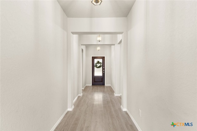 419 Agave Flats Dr, New Braunfels, TX 78130 - doorway to outside featuring wood finished floors and baseboards