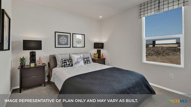 carpeted bedroom featuring baseboards