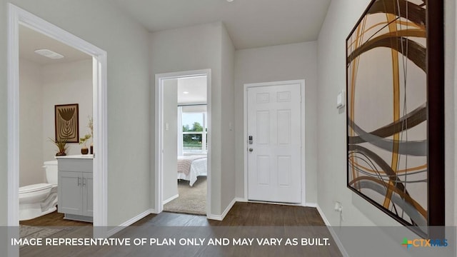 entrance foyer with dark wood-style flooring and baseboards