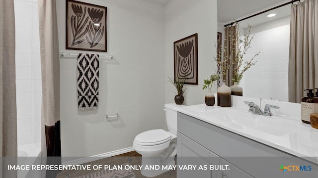 bathroom with baseboards, vanity, and toilet