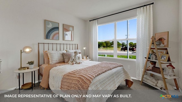 bedroom featuring carpet and baseboards