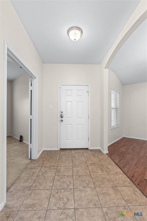 foyer with light tile patterned floors