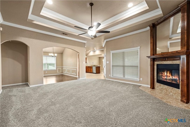 1722 Shadow Canyon Dr, Temple, TX 76502 - unfurnished living room with crown molding, arched walkways, a raised ceiling, carpet, and recessed lighting