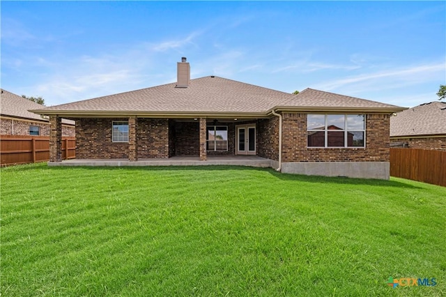 1722 Shadow Canyon Dr, Temple, TX 76502 - back of house featuring a chimney, a fenced backyard, brick siding, and french doors