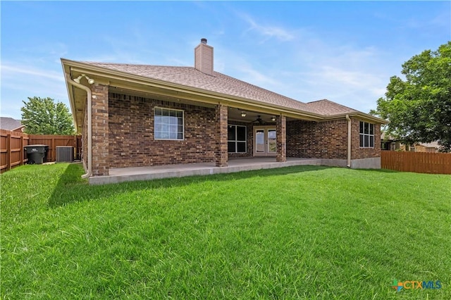 1722 Shadow Canyon Dr, Temple, TX 76502 - back of house featuring ceiling fan, a chimney, brick siding, roof with shingles, and a patio area