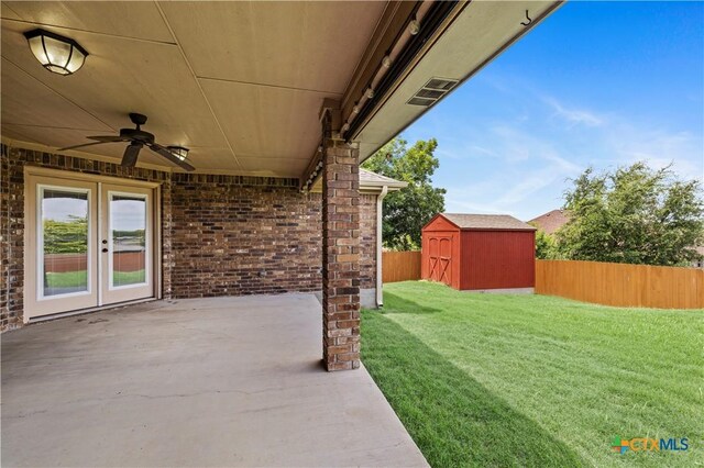 1722 Shadow Canyon Dr, Temple, TX 76502 - fenced backyard featuring a patio area, a storage unit, a ceiling fan, and french doors