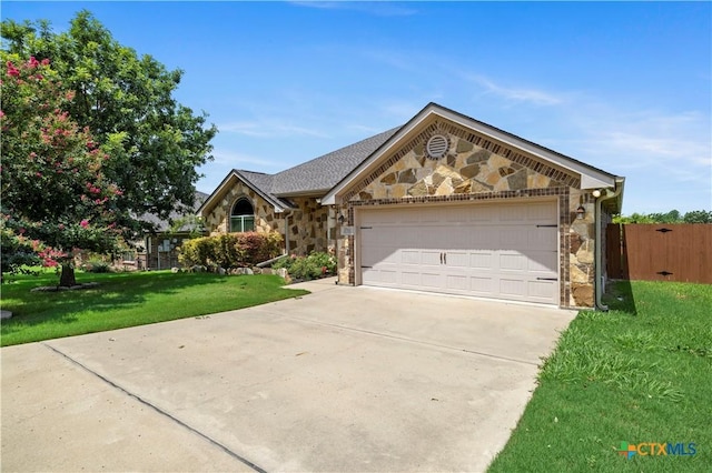 1722 Shadow Canyon Dr, Temple, TX 76502 - view of front of property featuring stone siding, driveway, and a garage