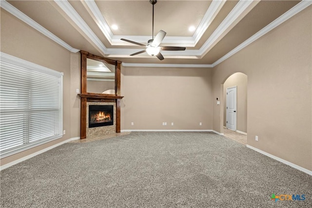 1722 Shadow Canyon Dr, Temple, TX 76502 - unfurnished living room with ceiling fan, ornamental molding, arched walkways, carpet flooring, and a raised ceiling