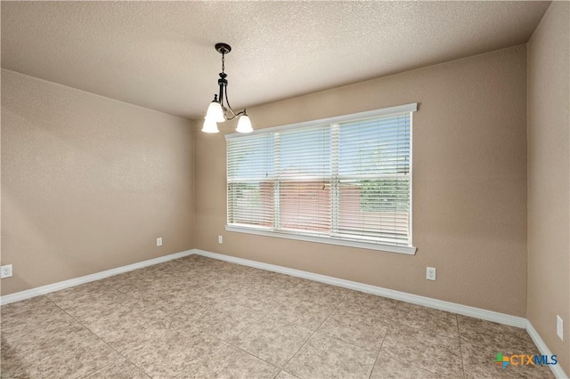 1722 Shadow Canyon Dr, Temple, TX 76502 - spare room with a textured ceiling and light tile patterned flooring