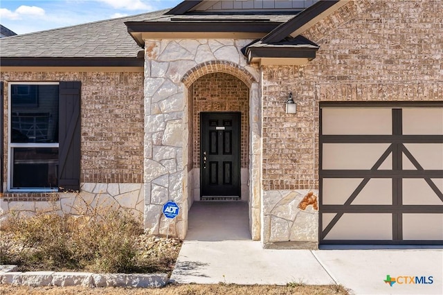 entrance to property featuring a garage