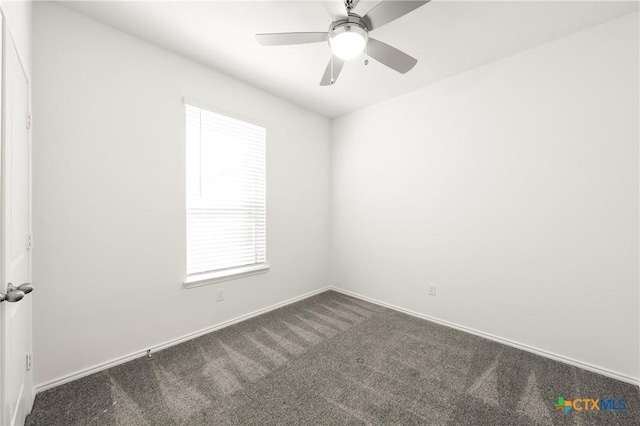 carpeted empty room with plenty of natural light and ceiling fan