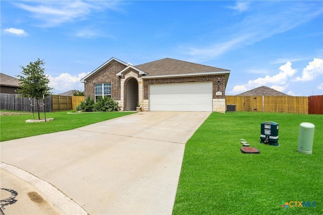 1041 Lakeway Crossing Dr, Temple, TX 76502 - view of front of home with brick siding, a garage, driveway, stone siding, and roof with shingles