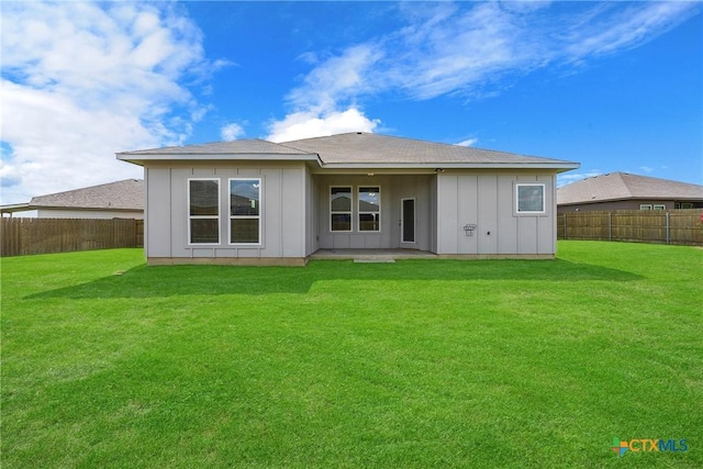 1041 Lakeway Crossing Dr, Temple, TX 76502 - back of property with board and batten siding and a patio area