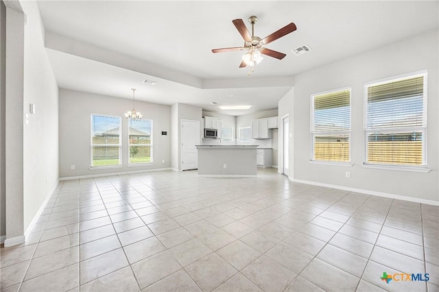 1041 Lakeway Crossing Dr, Temple, TX 76502 - unfurnished living room with a chandelier, light tile patterned floors, a ceiling fan, and baseboards