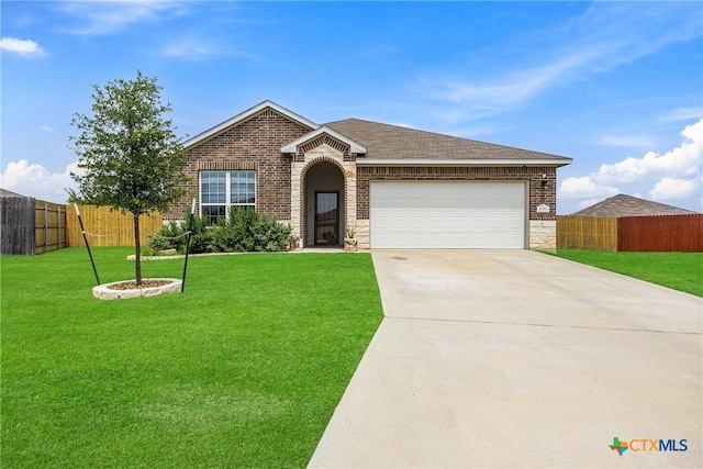 1041 Lakeway Crossing Dr, Temple, TX 76502 - view of front of house featuring an attached garage, driveway, brick siding, and a shingled roof