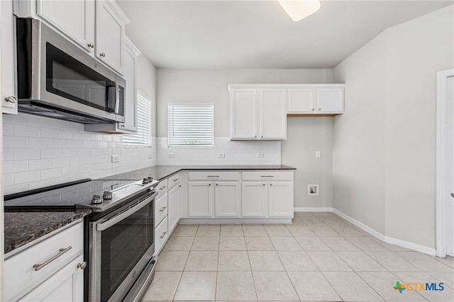 1041 Lakeway Crossing Dr, Temple, TX 76502 - kitchen featuring stainless steel appliances, tasteful backsplash, white cabinetry, and light tile patterned floors