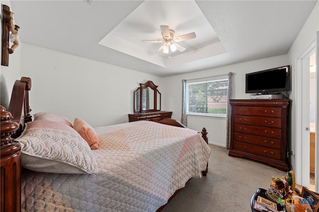 605 Aikman Dr, Troy, TX 76579 - bedroom with light colored carpet, a raised ceiling, and a ceiling fan