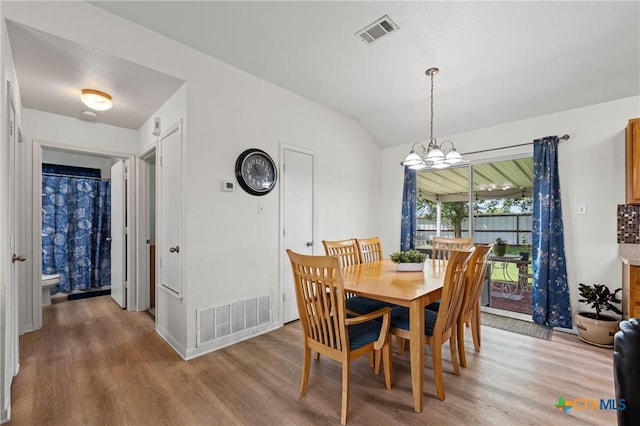 605 Aikman Dr, Troy, TX 76579 - dining space featuring light wood-type flooring, a chandelier, and lofted ceiling