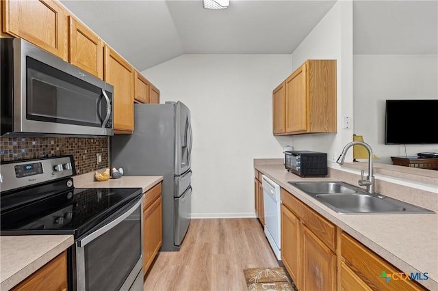 605 Aikman Dr, Troy, TX 76579 - kitchen featuring appliances with stainless steel finishes, light wood finished floors, lofted ceiling, light countertops, and tasteful backsplash