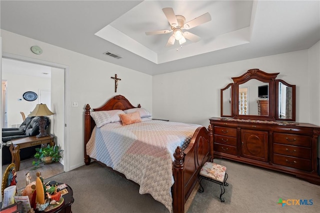 605 Aikman Dr, Troy, TX 76579 - bedroom with light carpet, a tray ceiling, and ceiling fan