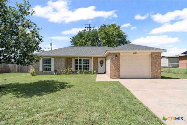 605 Aikman Dr, Troy, TX 76579 - ranch-style house with an attached garage, driveway, brick siding, and roof with shingles