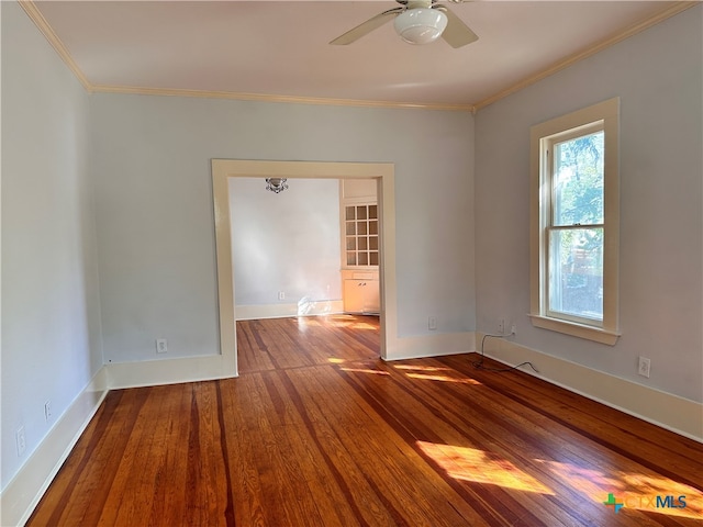 spare room featuring ornamental molding, hardwood / wood-style flooring, and ceiling fan