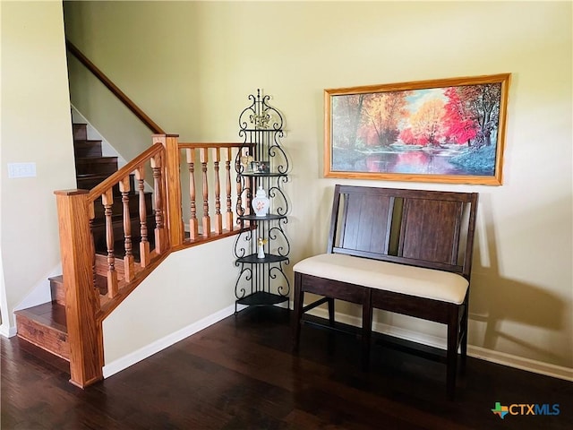 stairs with baseboards and wood finished floors
