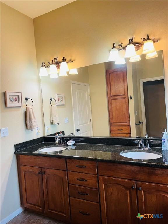 bathroom with vanity and tile patterned floors